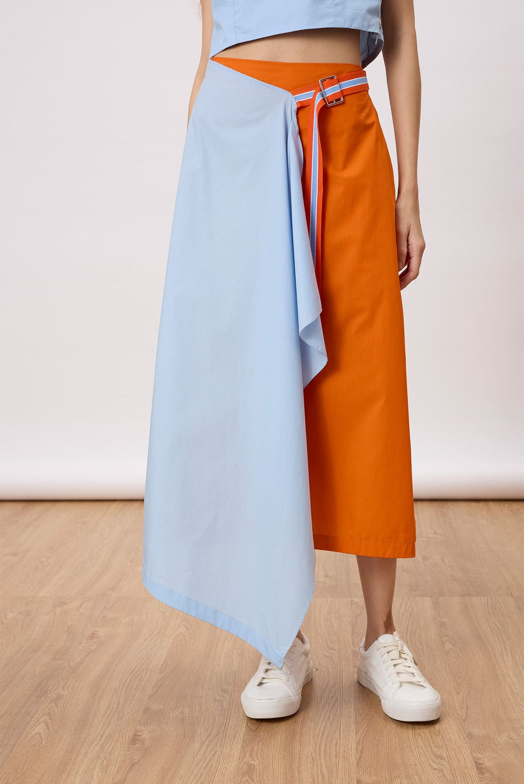 Rowan Skirt An A-line skirt with an assymertical drape layer