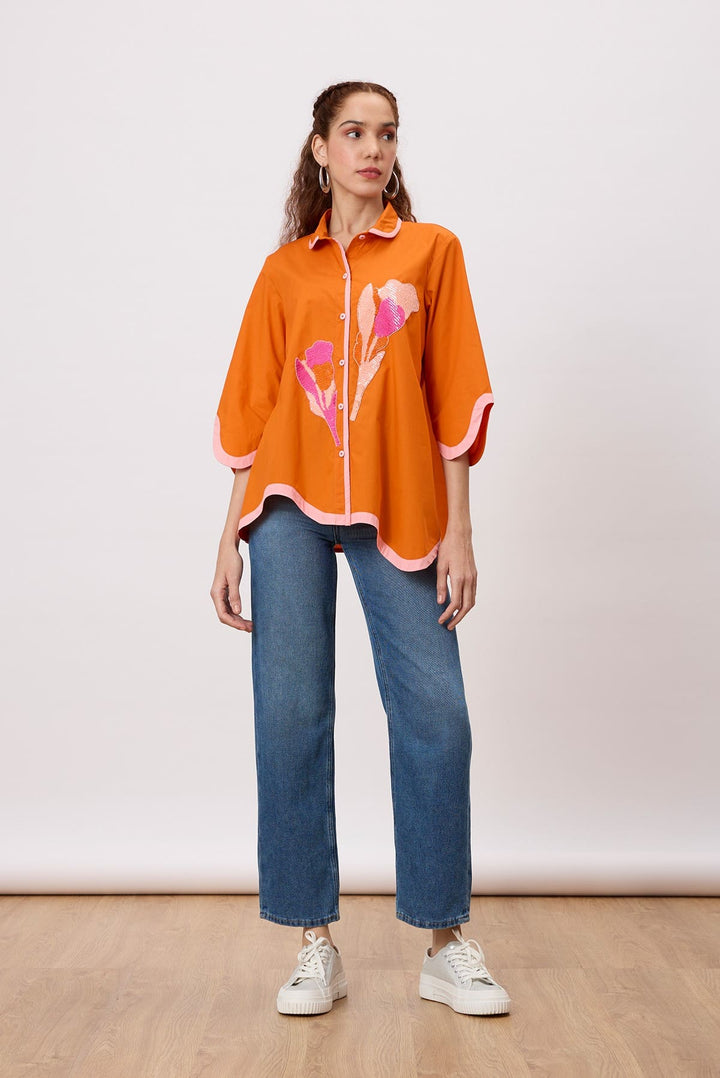 Liam Applique Shirt A charming button-down shirt with a wave shaped hemline and sequin