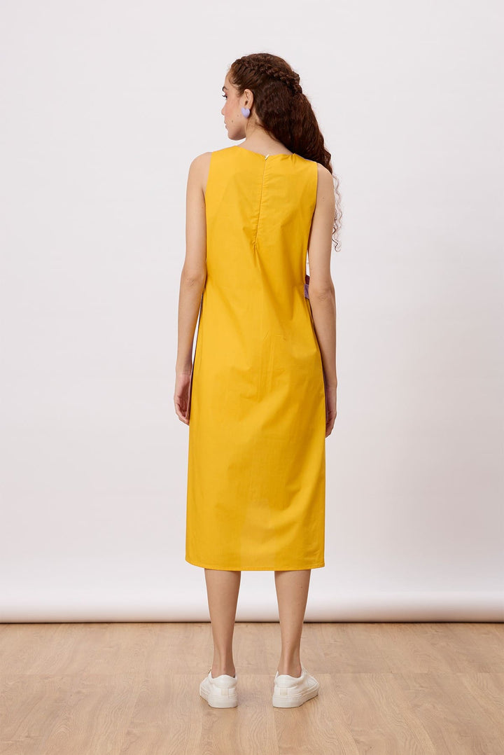 June Dress A relaxed, a-line dress with contrast panels and buckle belt detail at the sides