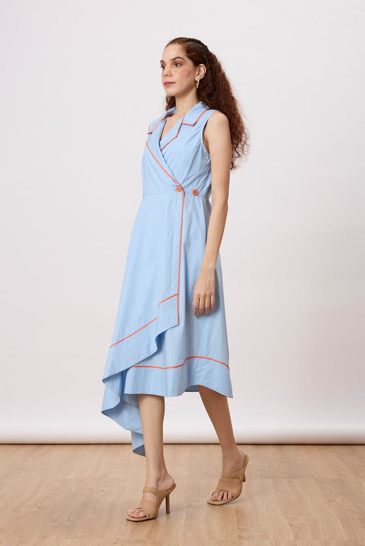 Heather Wrap Dress Sleeveless An a-line, midi-length dress with a classic notch collar, overlapping silhouette, an asymmetric hemline and contrast piping detail.