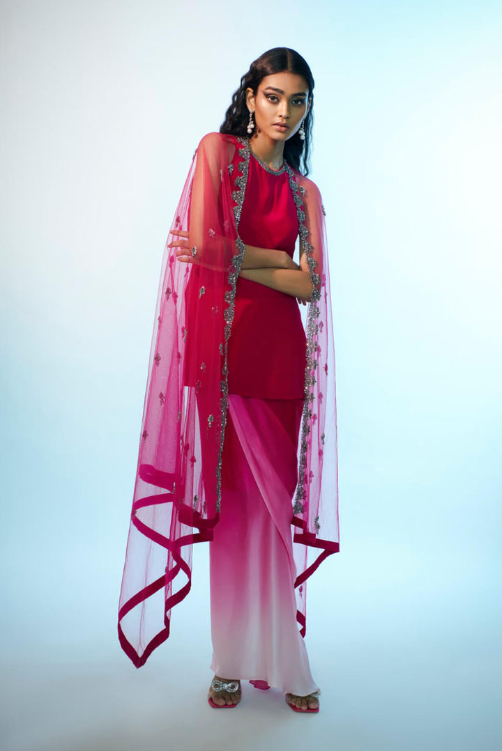 Tulle cape paired with satin skirt and short kurta