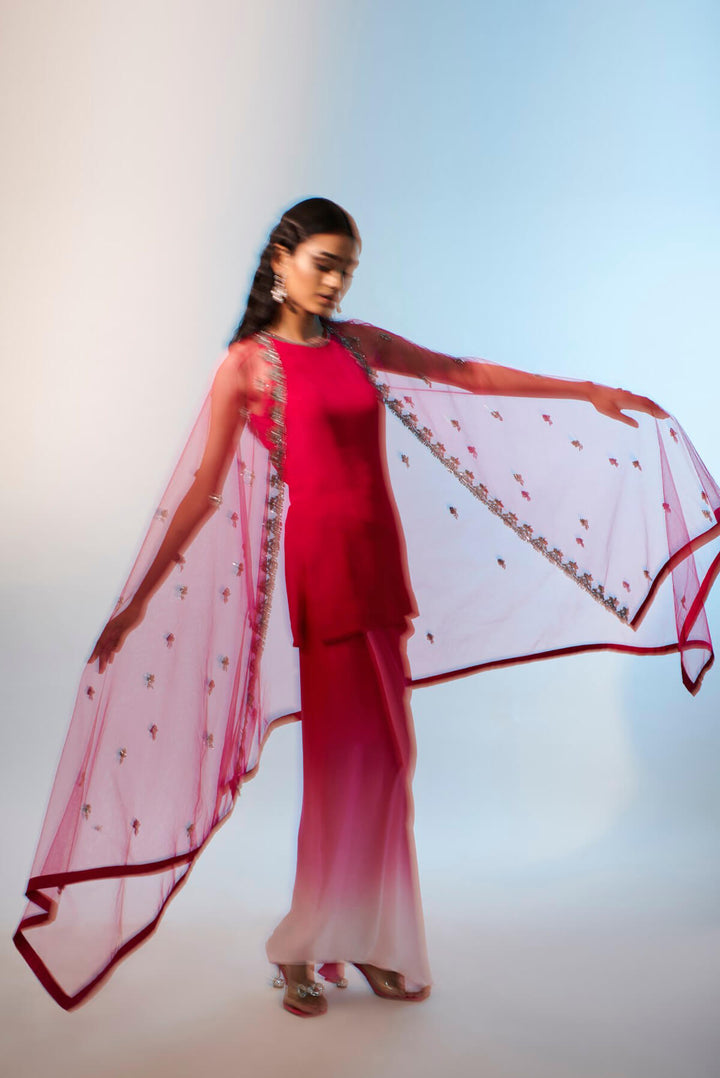 Tulle cape paired with satin skirt and short kurta