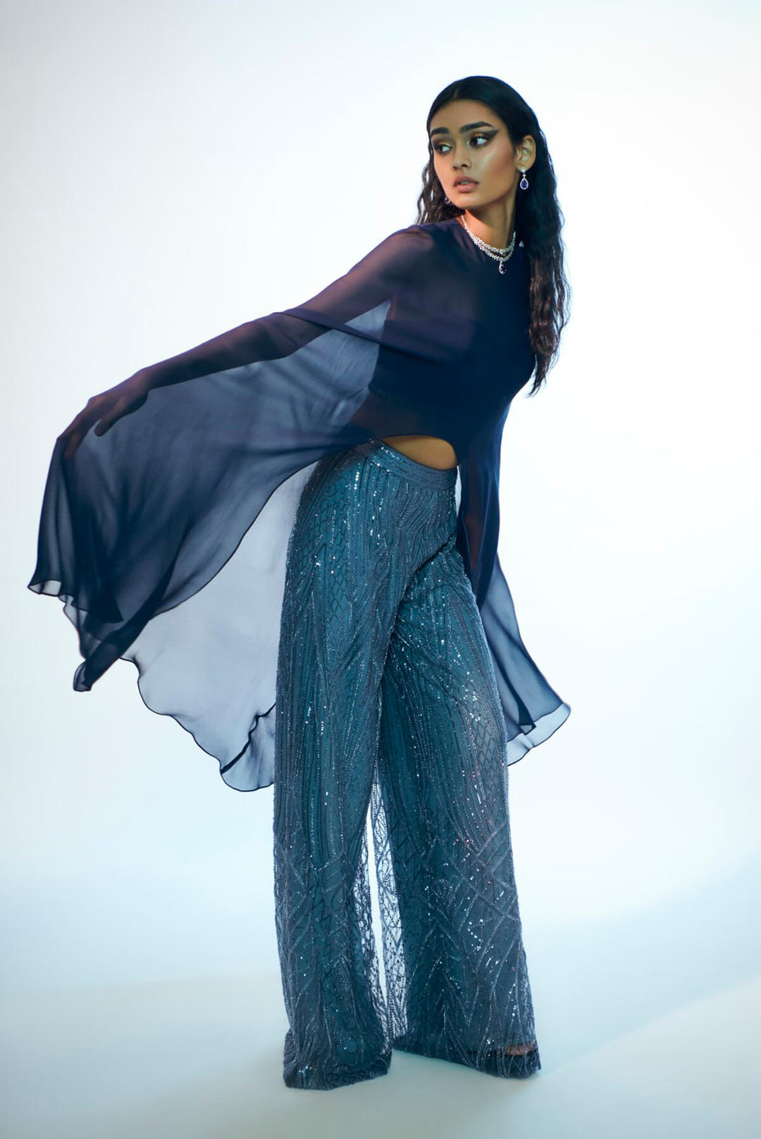 Embroidered pants with flowing cape