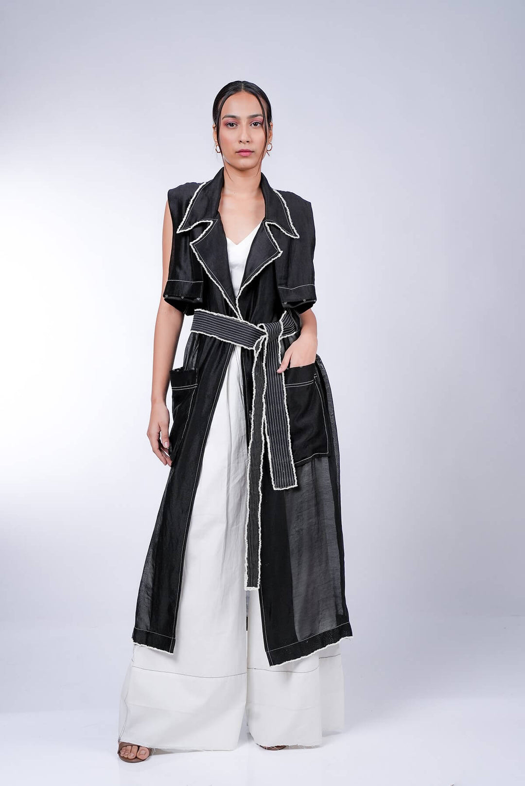 Black Trench With White Pleated Pants